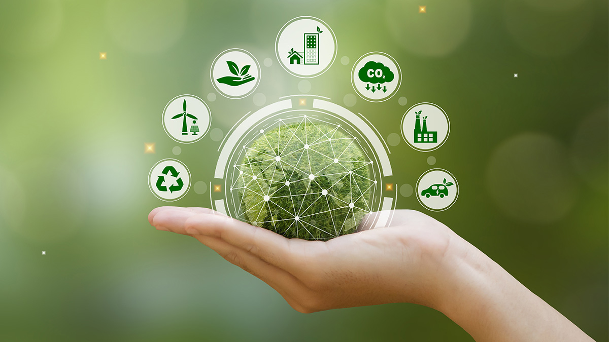 Hand holding green moss sphere with circular eco-icons for sustainability and carbon reduction